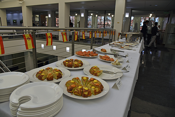 a food table display shows of Spanish tortilla and other tapas