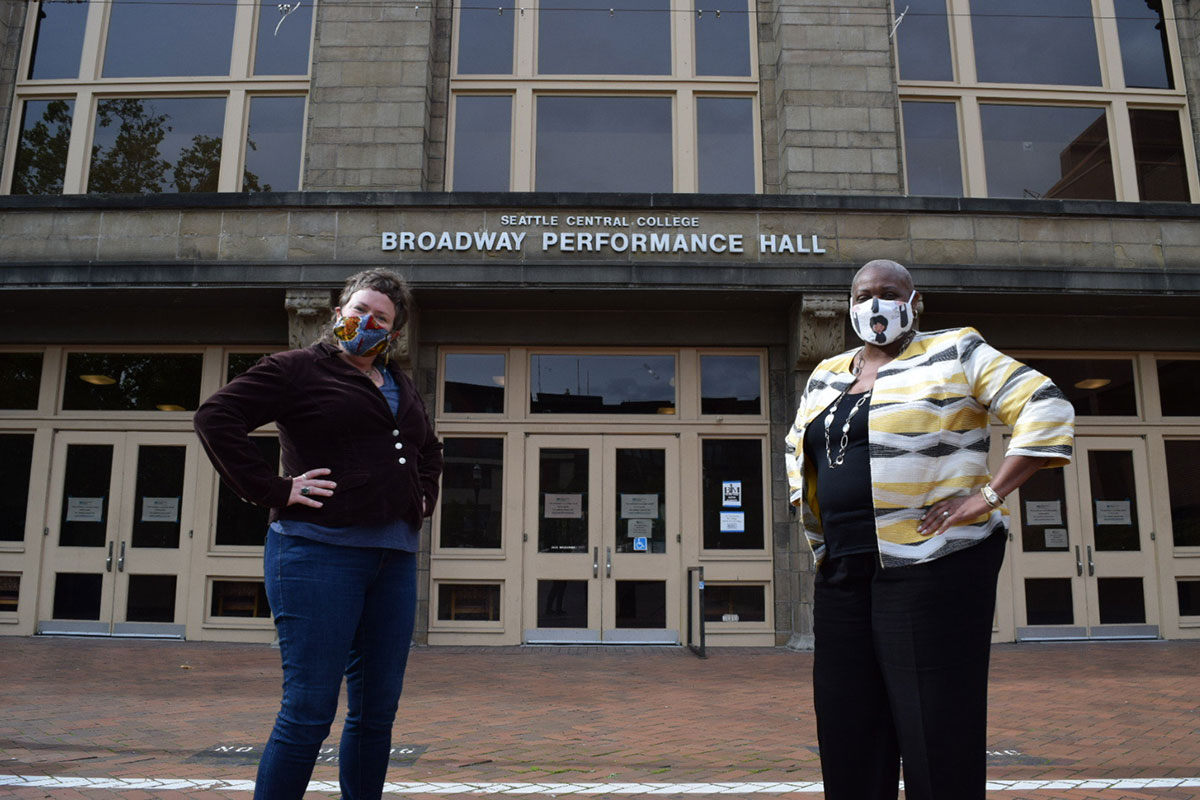 Zeyl and Edwards Lange pose in front of the Broadway Performance Hall 