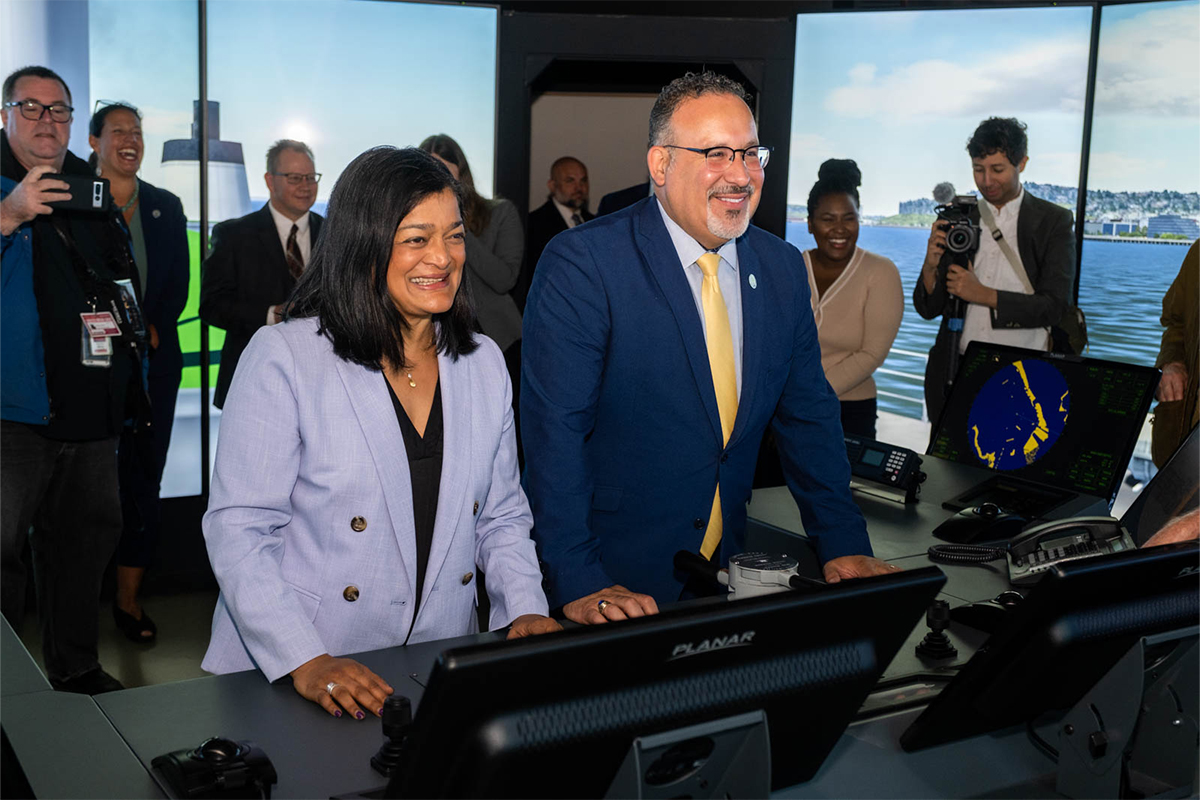 a photo of Rep. Jayapal and Education Secretary Cardona 