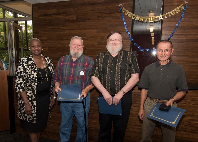 Allan Hikida, Dale Oberlander, and Ed Ciok celebrate retirement