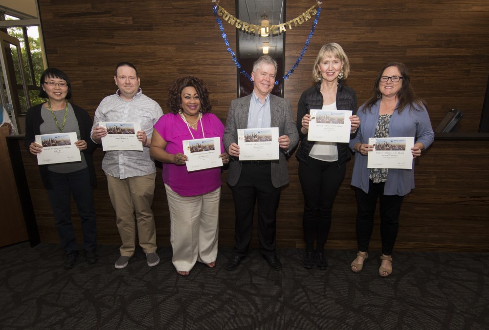 Gail Claassen, Barbara Coston, Thomas Davis, Doug Romine, Alexandrea Skidmore, and Felice Tiu receive awards