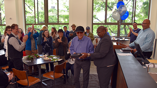 President Sheila Edwards Lange presents an award during the 2019 employee celebration