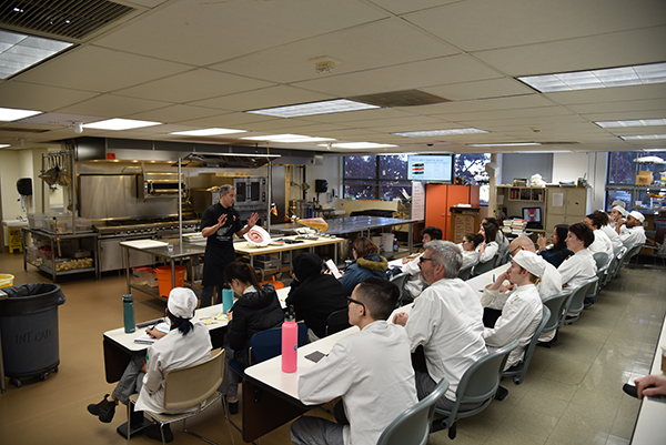 a culinary class gets a lesson about jamon iberico