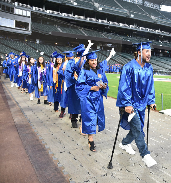 students march during the opening procession at commencement