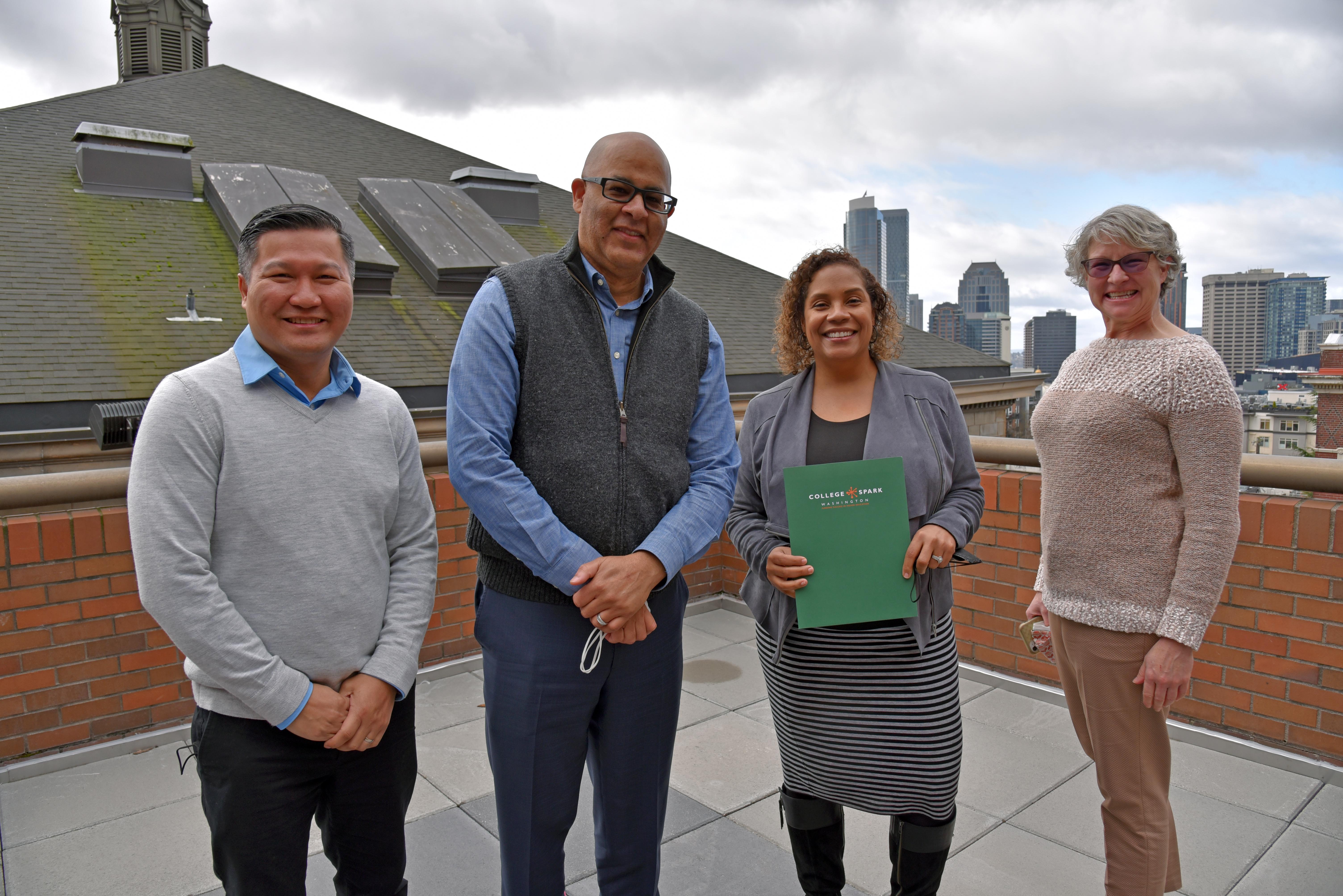 Sy Ear, Warren Brown, Yoshiko Harden and Wendy Rockhill pose for a picture on the fourth floor deck