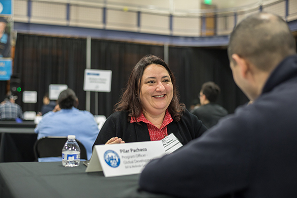 A mentor from the Gates Foundation counsels a student