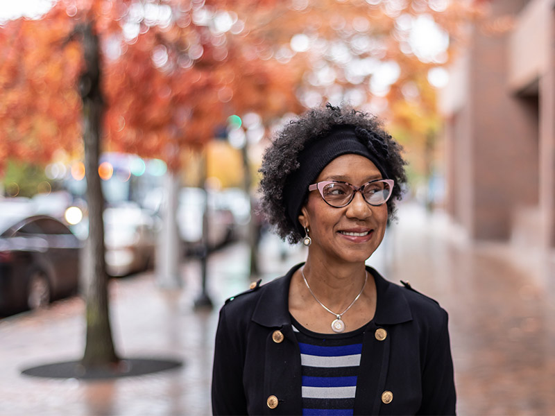 Patricia Barnes on the Broadway entrance to campus.