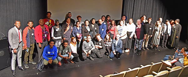 scholarship winners pose for a picture on the stage